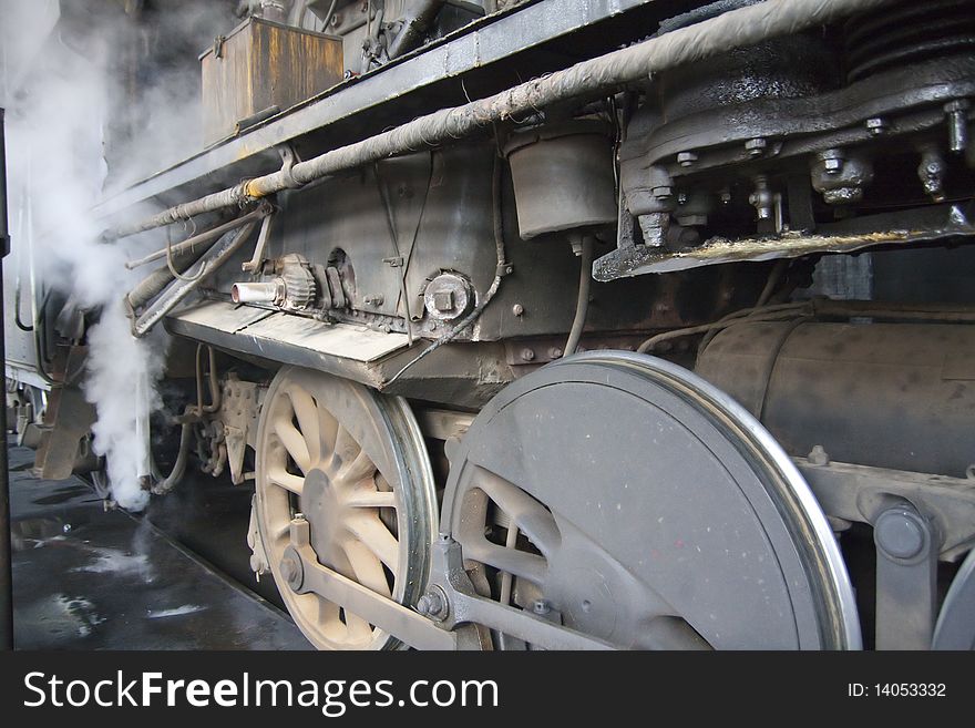 The wheels of the old-fashioned steam locomotive. The wheels of the old-fashioned steam locomotive