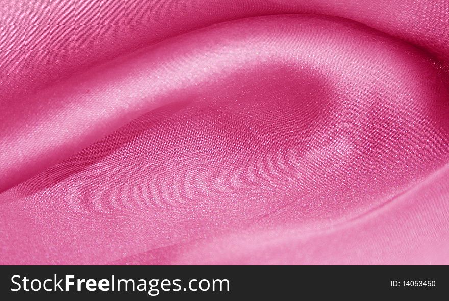 The texture of pink organza fabric. The texture of pink organza fabric.