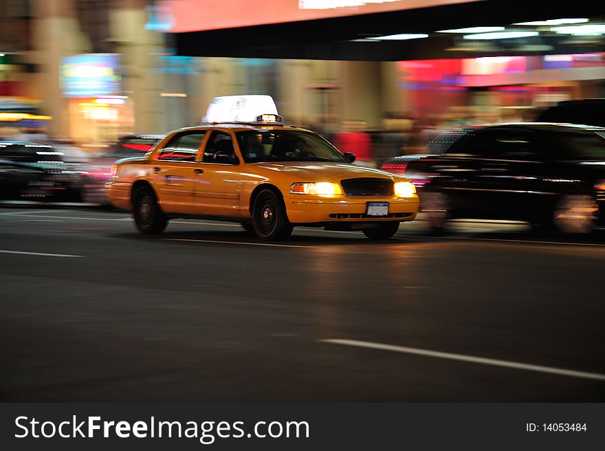 Yellow cab in motion at night in NYC. Yellow cab in motion at night in NYC.