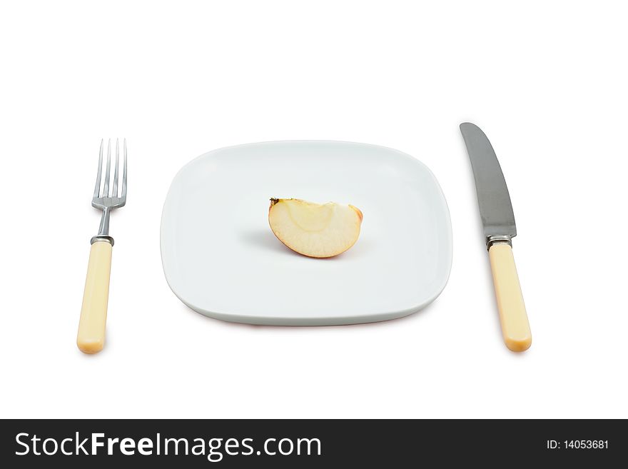Knife, plug and plate with  segment of apple on white background