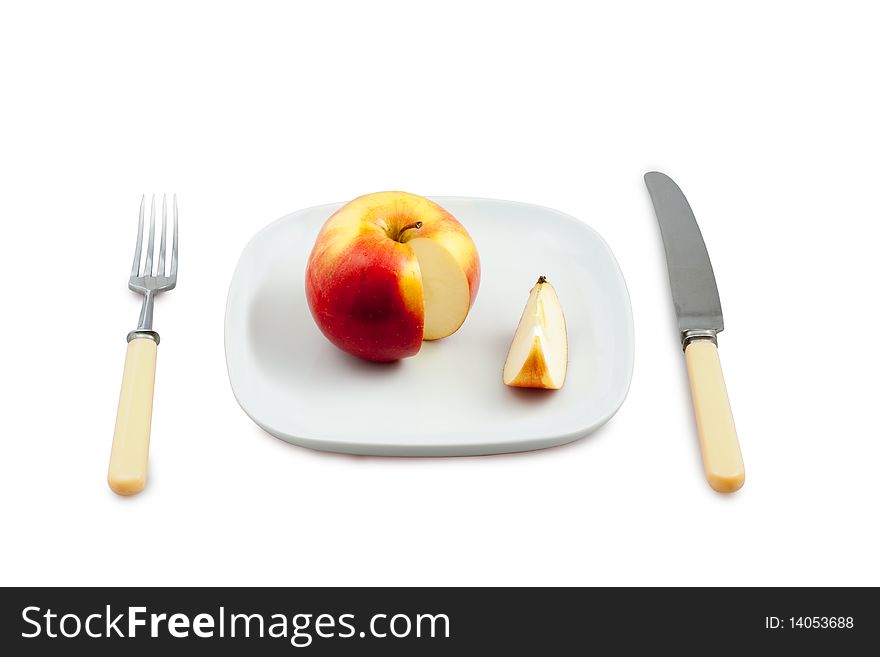 Knife, plug and plate with  incision apple on white background