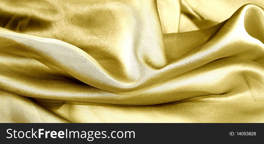 The texture of the material gold organza.