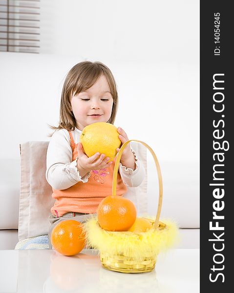 Happy little girl with fruits