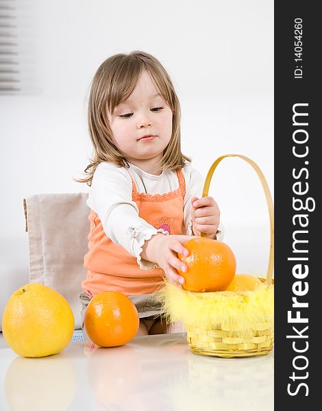 Happy little girl with fruits