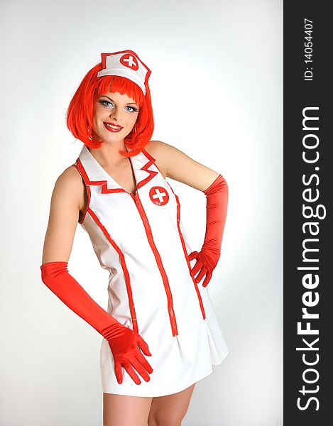 Young sexy nurse with red hair