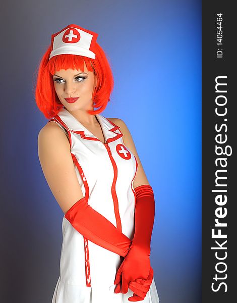 Young sexy nurse with red hair