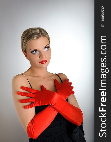 Portrait of fashion woman with red lips and gloves looking up. white background. Portrait of fashion woman with red lips and gloves looking up. white background