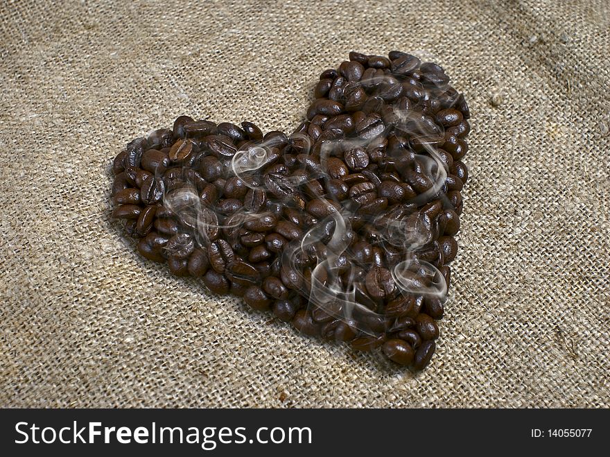 Roasted coffee beans in the shape of the heart. Roasted coffee beans in the shape of the heart.