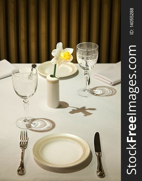 Photo of served table in restaurant with flower