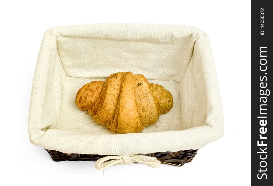Resh bread rolls in a basket on white