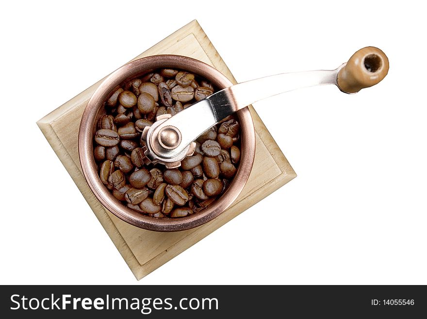 Coffee grinder with coffee grains it is isolated on a white background