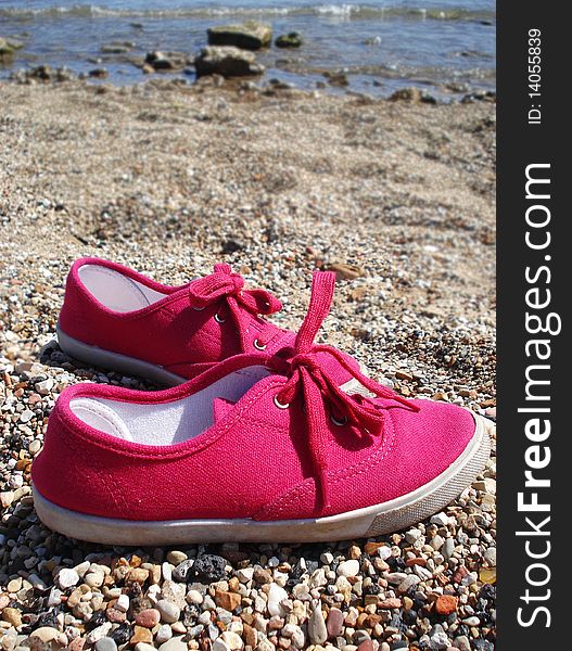 Pink coloured shoes with nature background. Pink coloured shoes with nature background