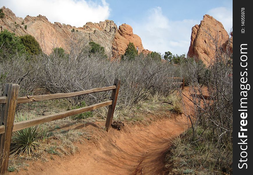 The beautiful walkways and gates along trails of The Garden of the gods in Colorado. A popular National Park visited by millions of people. A favorite among hikers and rock climbers along with walkers .