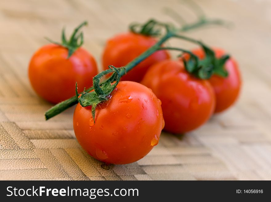 A Food Scene,close up shot,tomatoes on the vine .