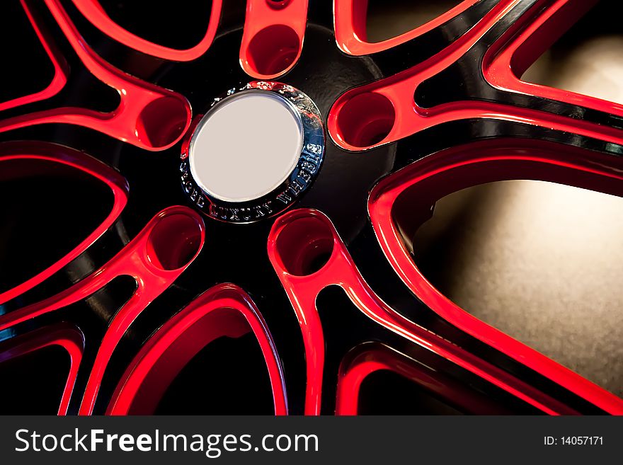 Red Metallic tyre disc of a sport car