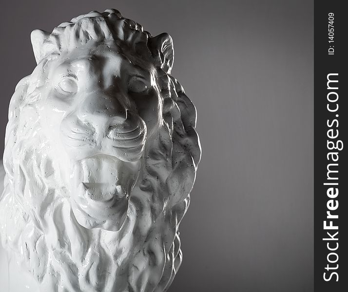 Plaster statue of lion in studio