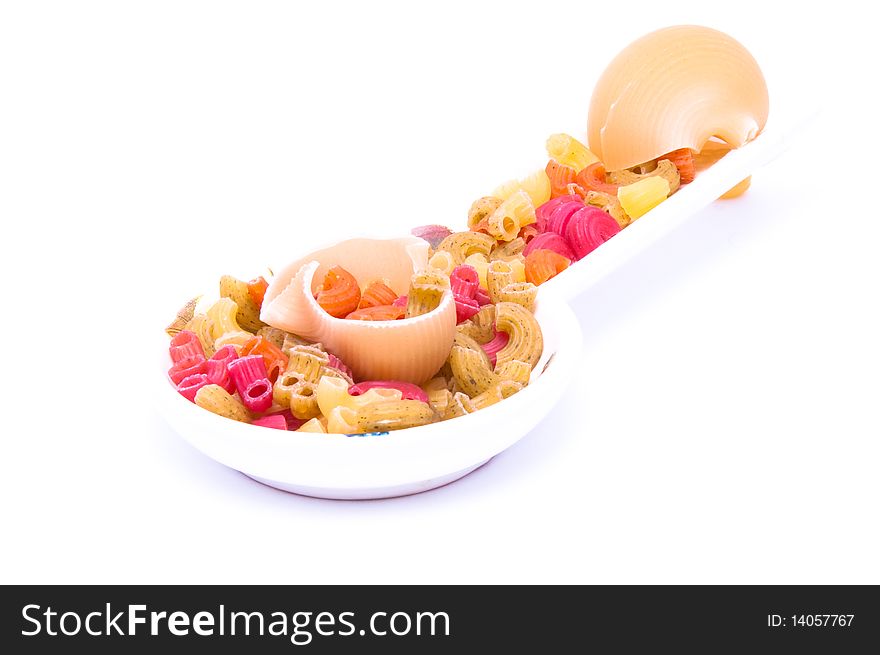 A plateful of colored macaroni isolated on white