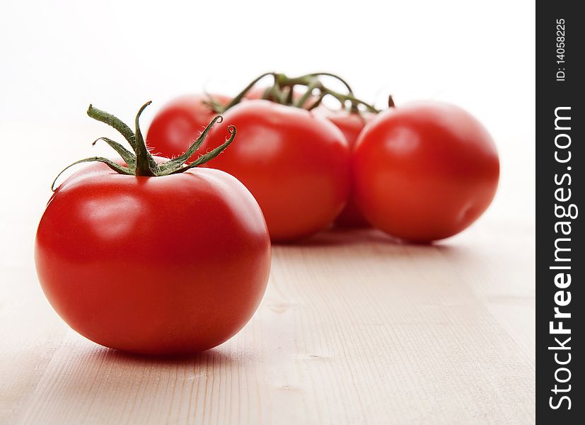 Natural red tomatoes in studio. Natural red tomatoes in studio