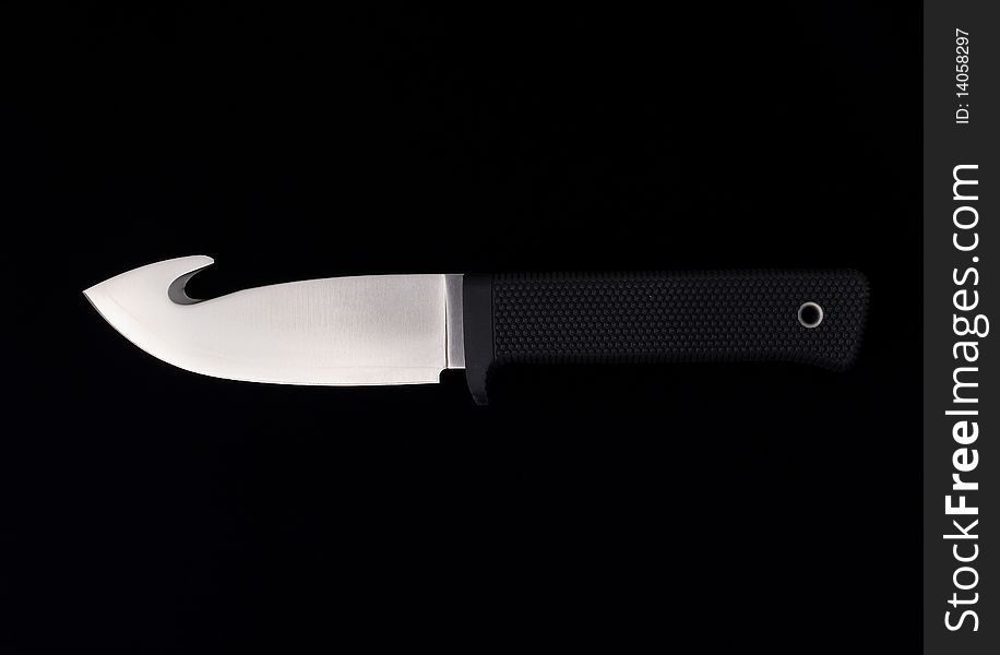 Textured sharpen knife on black background