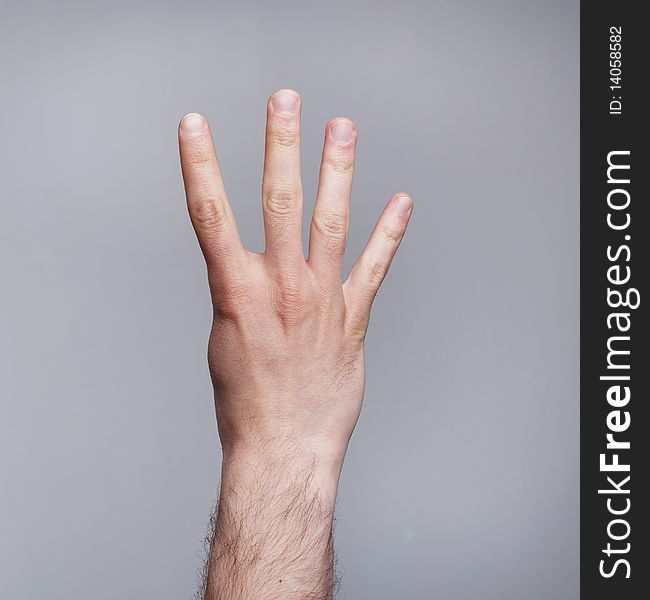 Figure of four fingers on grey background. Figure of four fingers on grey background