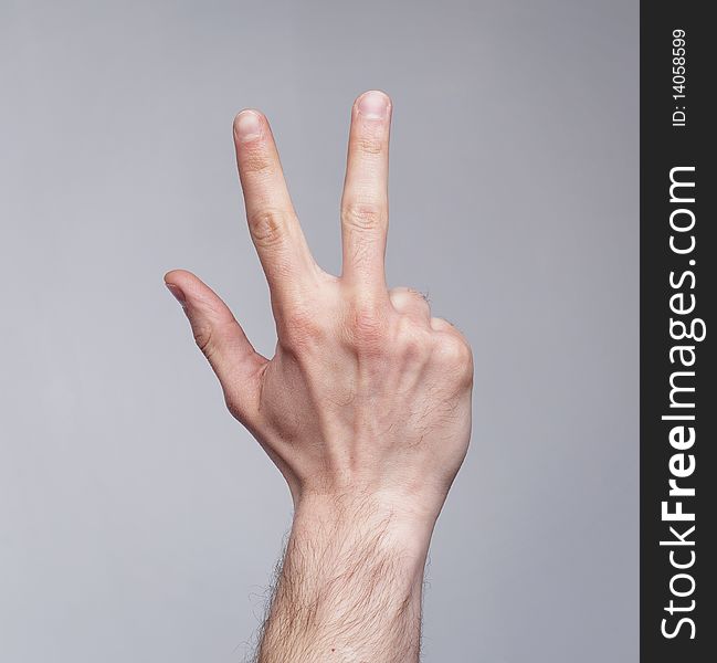 Figure of three fingers on grey background. Figure of three fingers on grey background