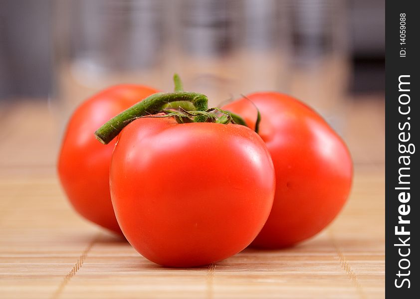 Red salad and tomato on brown bamboo napkin. Red salad and tomato on brown bamboo napkin