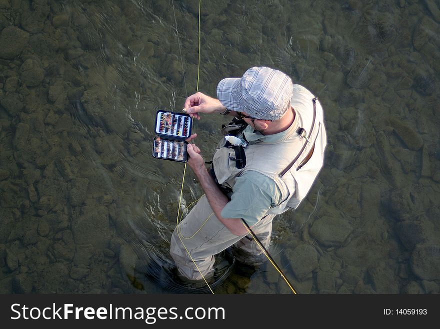 Angler on the small river. Angler on the small river