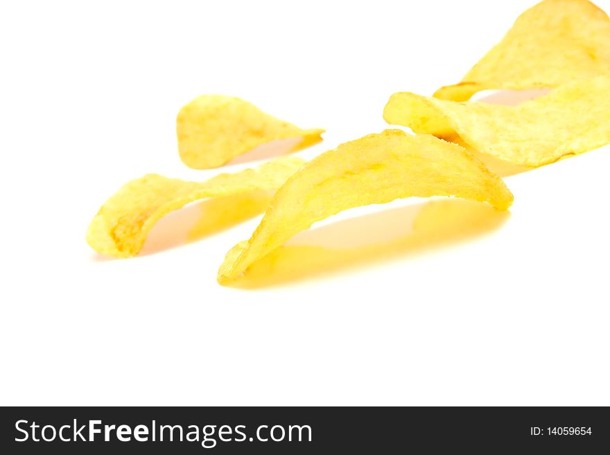 Isolated pile of unhealth snack - potato chips