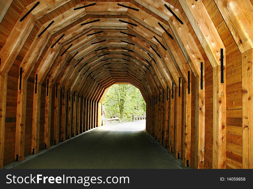 Looking down the middle of a wooden tunnel