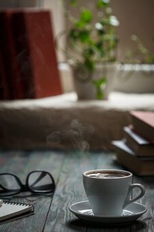A Cup Of Coffee In The Workplace On A Wooden Table Stock Photography A Cup Of Coffee In The Workplace On A Wooden Table Stock Photography