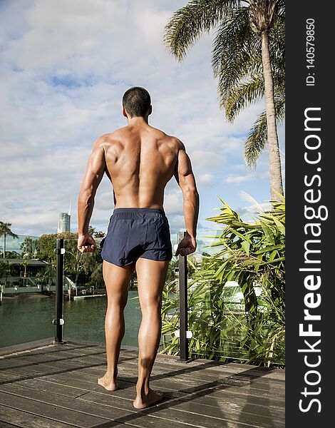 Fitness Trainer Standing On Wooden Floor