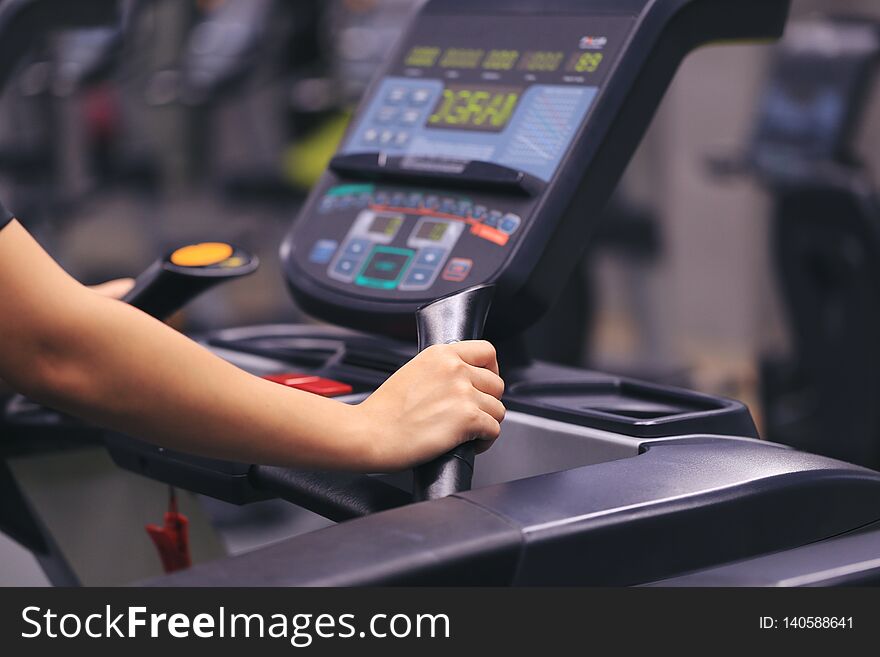 Fitness woman running on treadmill and burn fat in the body in the gym, Healthy lifestyle and sport concept
