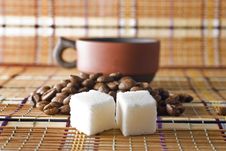 A Cup Of Coffee, Sugar Cubes And Coffee Beans Royalty Free Stock Image