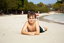 Happy Boy Lying At The Beach Royalty Free Stock Photo Happy Boy Lying At The Beach Royalty Free Stock Photo