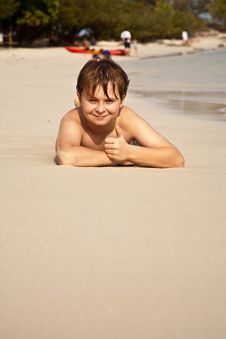 Happy Boy Lying At The Beach Royalty Free Stock Images Happy Boy Lying At The Beach Royalty Free Stock Images
