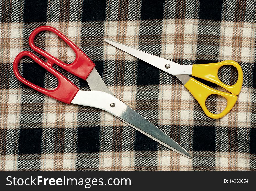A two scissors on the fabric