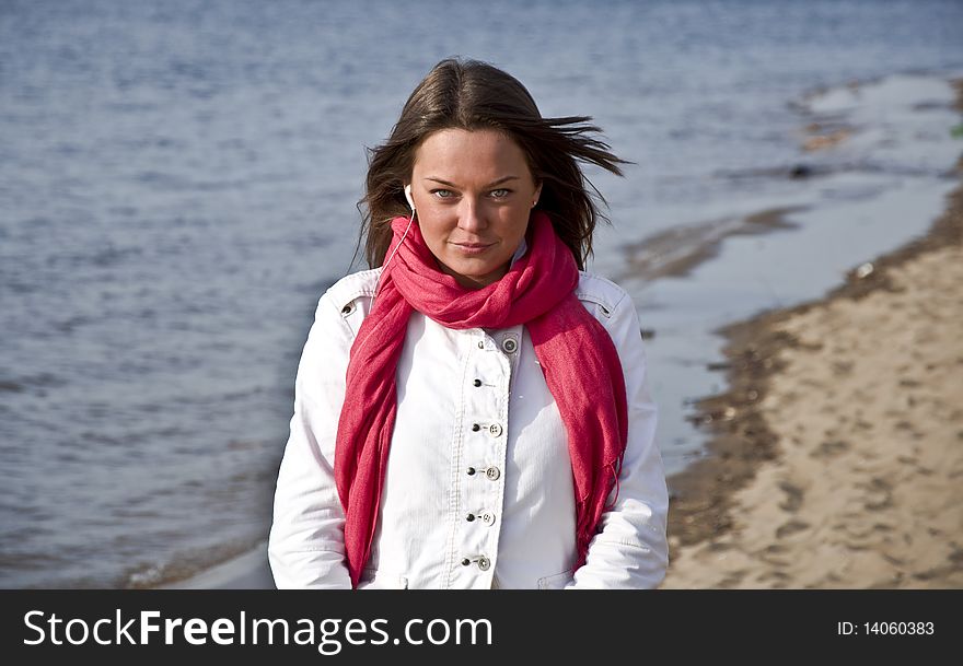 Young Girl Walking On The Beach