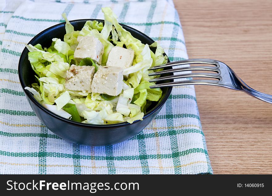 Lettuce salad with tofu cheese. Lettuce salad with tofu cheese