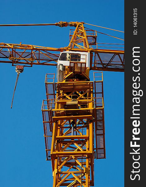 Detail of crane with blue sky in background. Detail of crane with blue sky in background