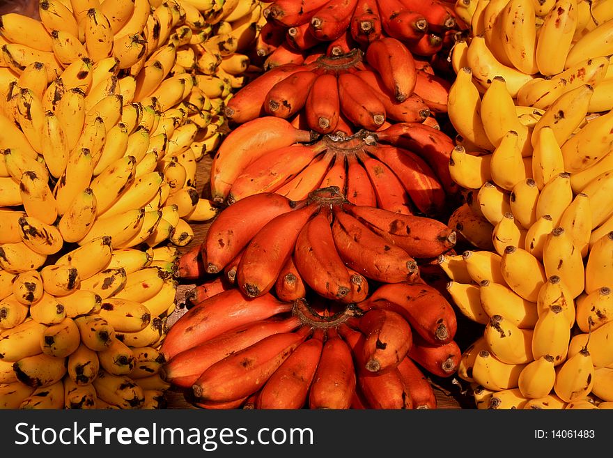 Red and yellow bananas displayed at mexican market
