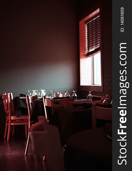 Restaurant dining room tables, natural window light. Restaurant dining room tables, natural window light.