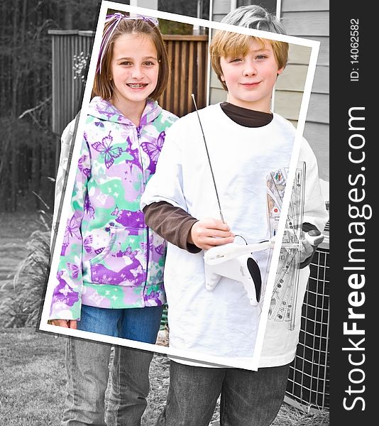 Frame within a photo style image of a young girl and boy. He's holding a remote control airplane. 10 years old