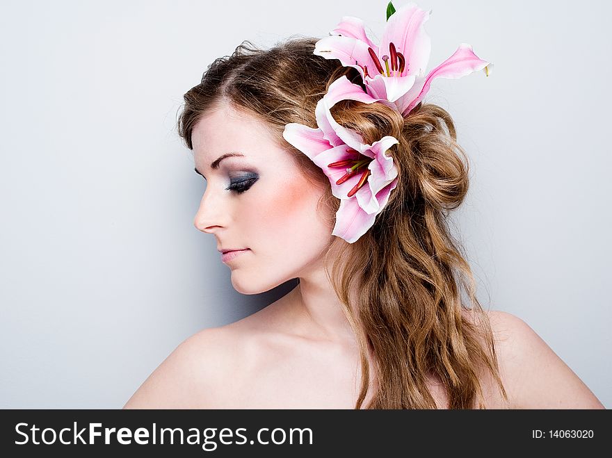 Close-up of beautiful girl with flowers On white background