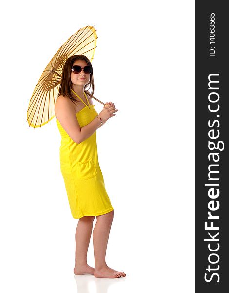 An barefppt young teen holding a parasol while wearing wunglasses and a bright yellow sundress.  Isolated on white. An barefppt young teen holding a parasol while wearing wunglasses and a bright yellow sundress.  Isolated on white.