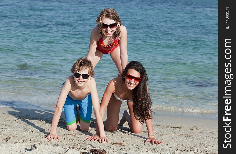 Teenagers Having Fun At The Beach