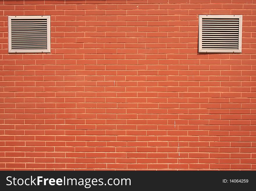 Brick red wall with vent,, blocks,flow,air