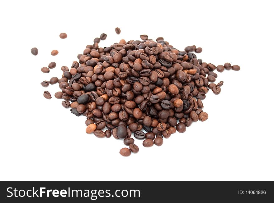 A pile of roasted coffee beans isolated on white background