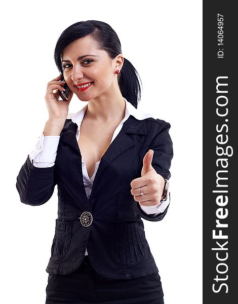 Businesswoman talking by cell phone and making OK sign