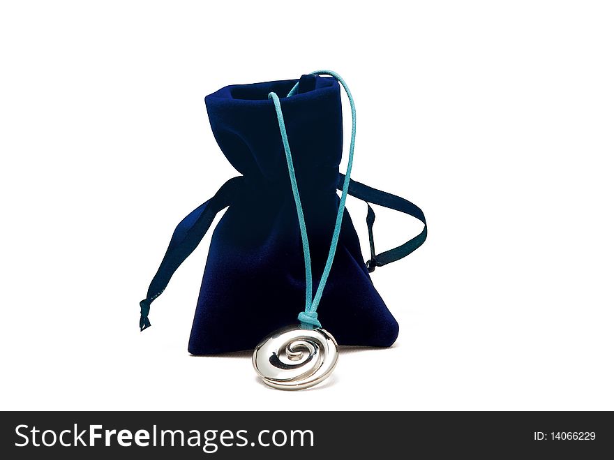 Blue and silver necklace and dark blue velour sack on white background