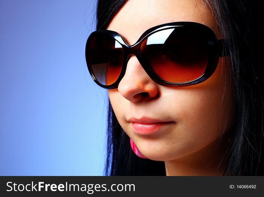 young woman posing with sunglasses